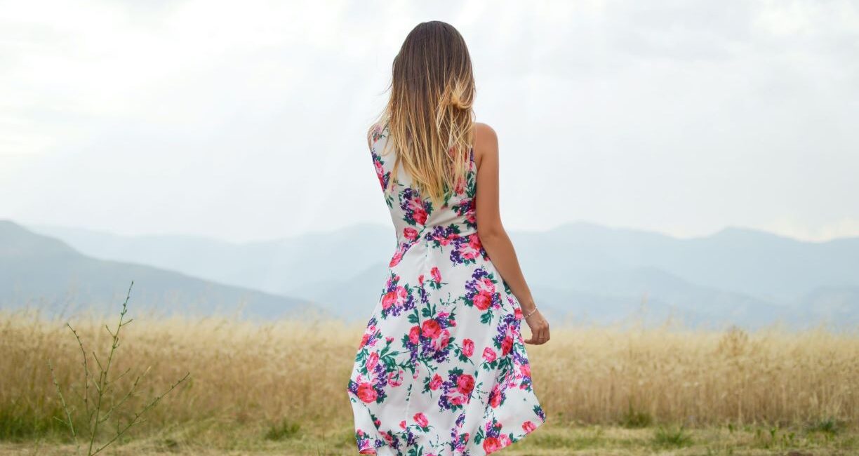 Girl in summer dress in field