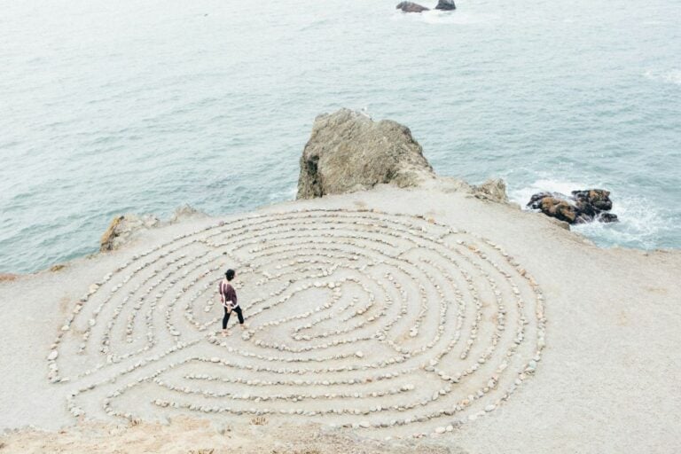 Person walking alone in brain shaped maze